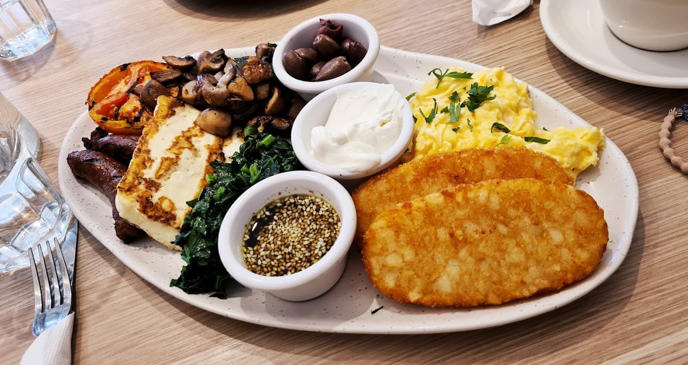 YOUIES - Skilled barista preparing a fresh coffee in our warm, inviting Belmore cafe